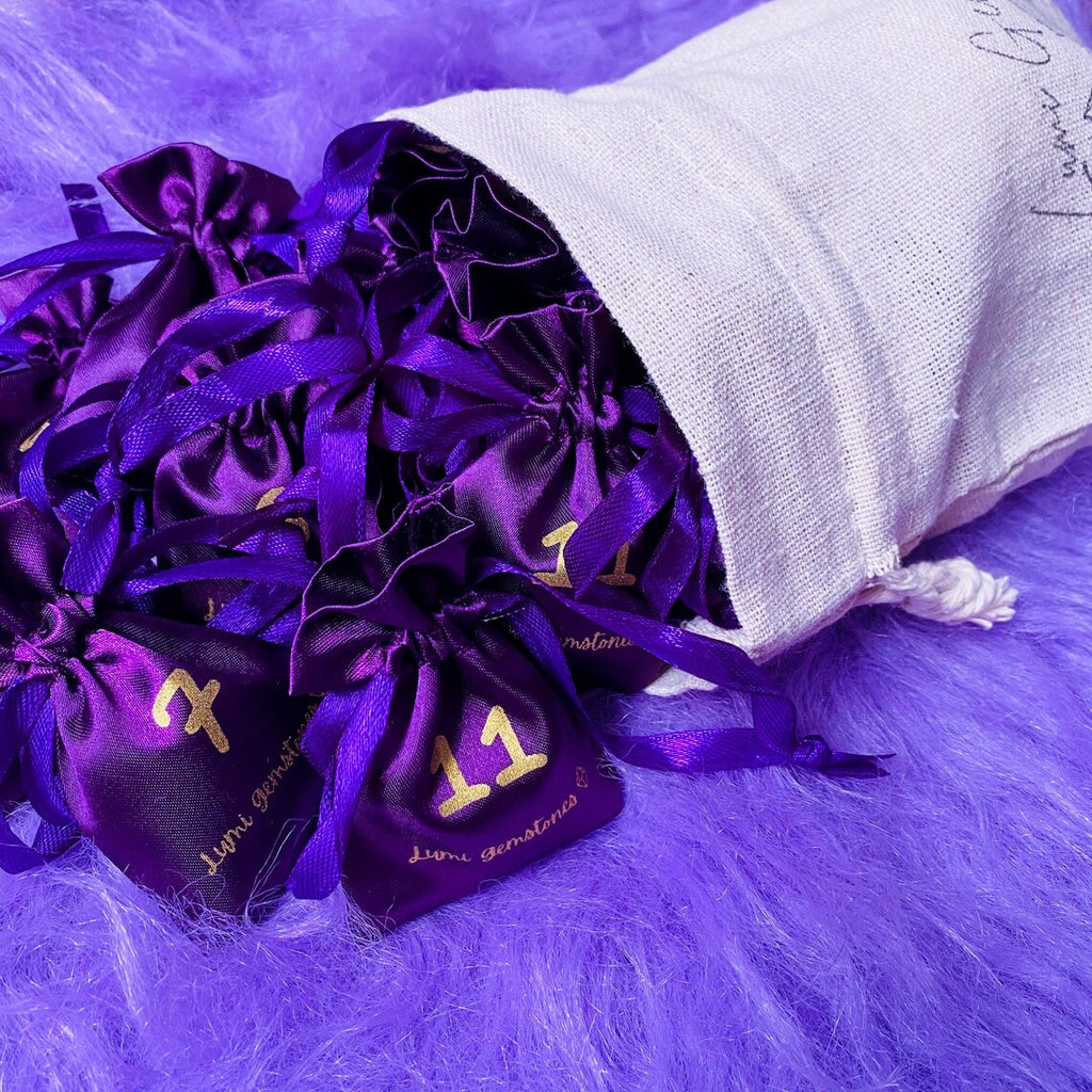 Christmas Advent Calendar, small purple bags inside a larger white cotton bag.